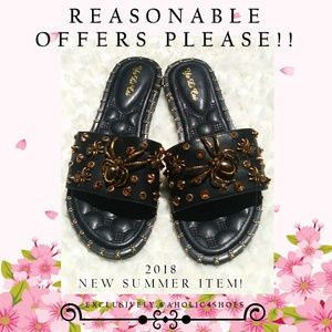 Black Flats With Gold Spider Embellishments.